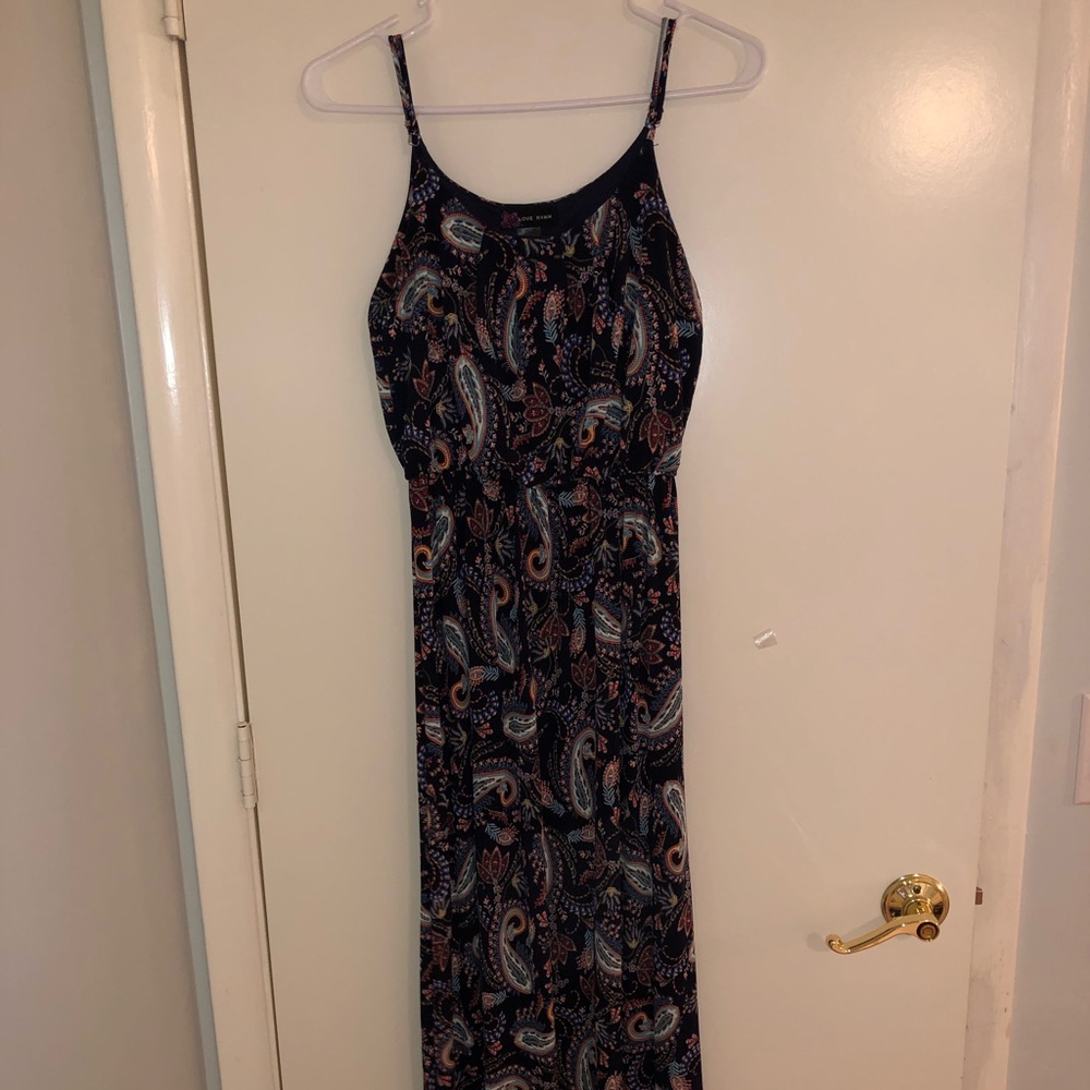 A black dress with designs.